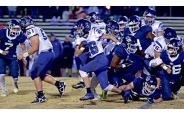 MNJ photo/Cory Smith - Lineman Sage Biddix (51) clears a path for running back Cole Young (26) 