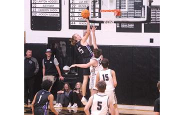Mountaineer Jordan Riddle goes up for 2 points against North Buncombe in the season opener. (Photo by Stephanie Warren)